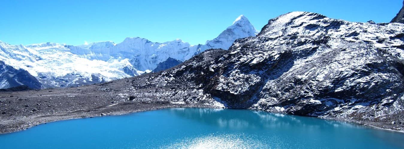Trekkers crossing glacial terrain in the Khumbu