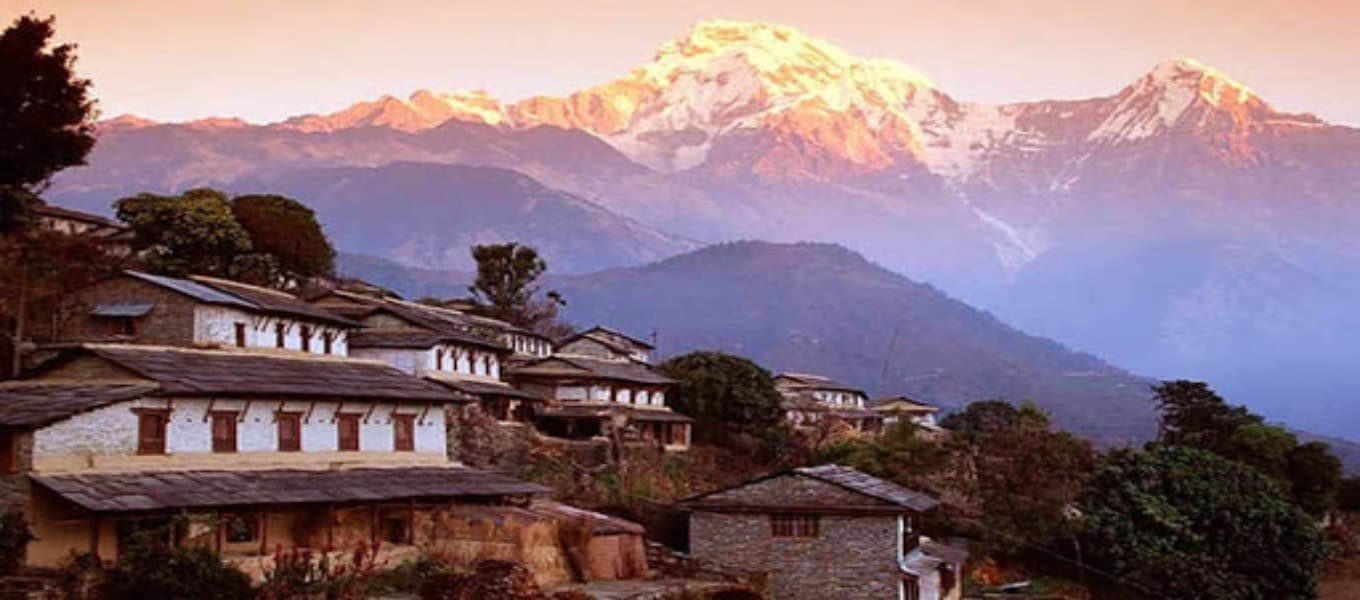 Family walking near Dhampus village with the Annapurna range behind